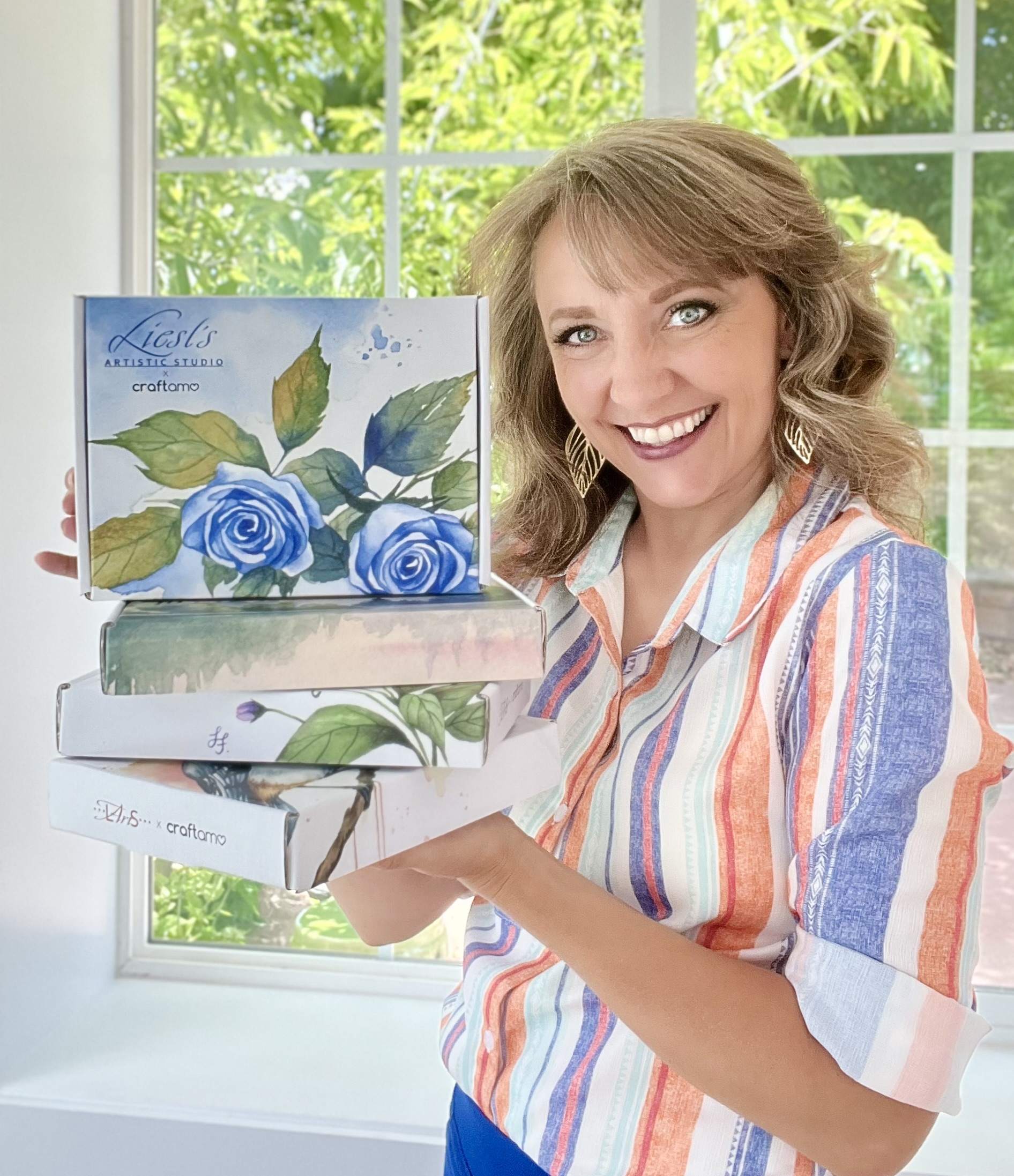 Liesl holding watercolor subscription boxes
